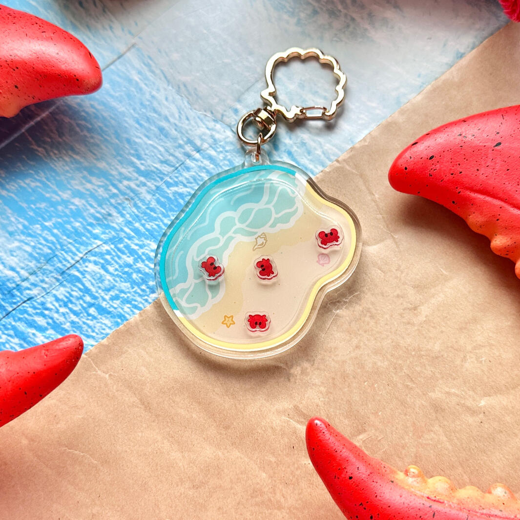 Sailor Shrimpp’s Crabs at the Beach shaker Keychain, one of our best sellers.